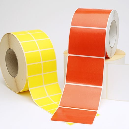 Yellow and orange sticker label rolls