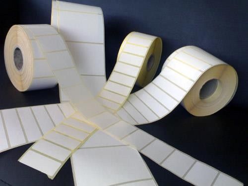 Blank sticker labels on dark background